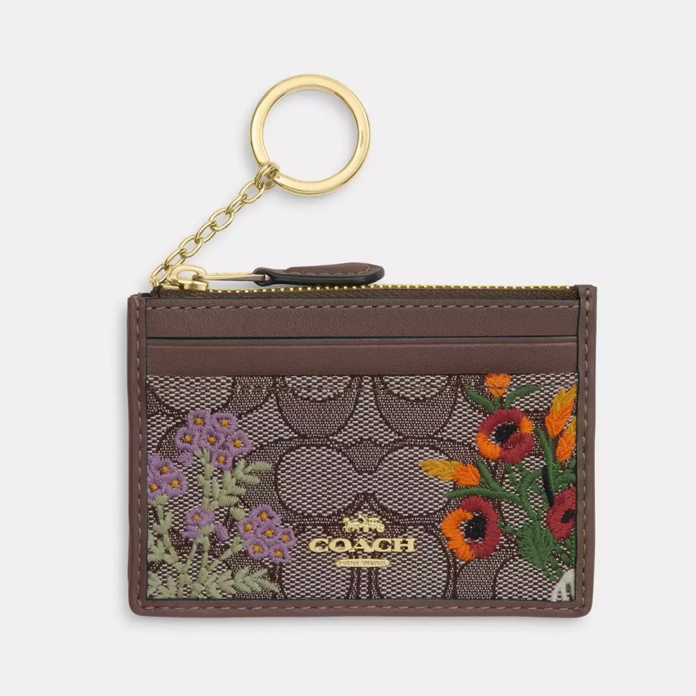 Mini Skinny Id Case
In Signature Jacquard With Floral Embroidery